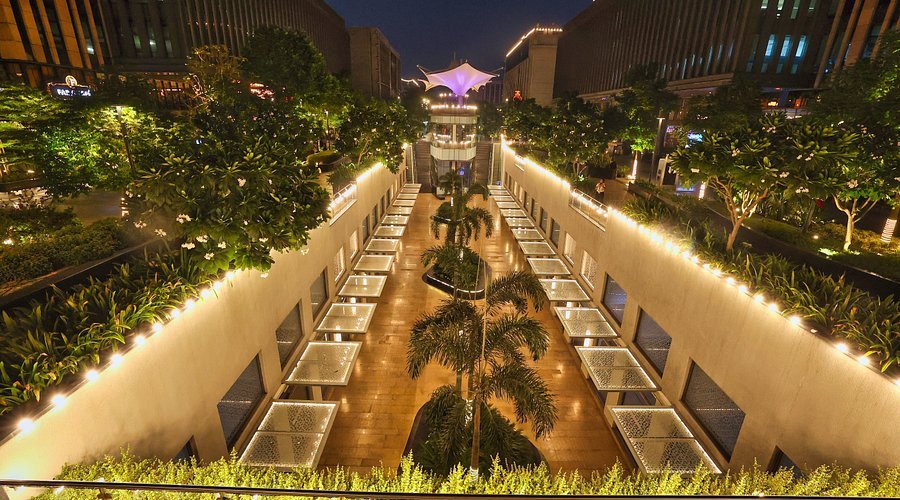 GMR Aerocity, Delhi, landscaped retail and dining promenade at night
