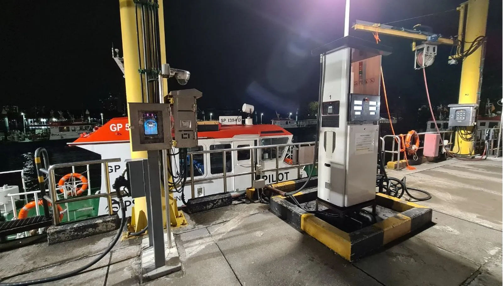 Secured biometric fuel bunkering station at night, PSA Marine base